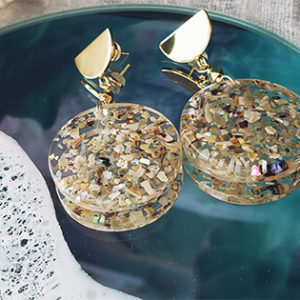 Seashell flecks in clear resin with gold semi circle earrings