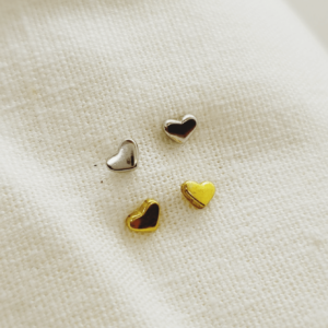 Tiny gold and silver heart earrings